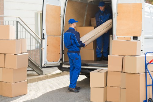 Removal team planning a house move near Aldgate streets