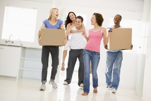 Removal team supporting a local move in Aldgate with boxes and furniture
