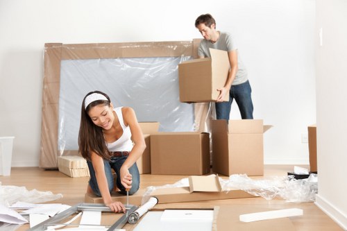 Removal team planning a move in Aldgate near busy city streets
