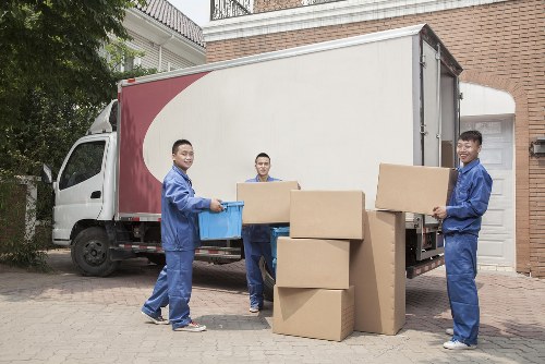 Packed office furniture and moving boxes prepared for transport