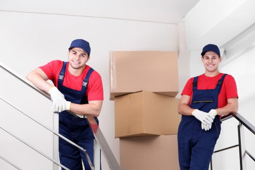 Professional movers packing household items in Aldgate