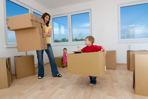 Loading furniture into a moving truck near Aldgate East