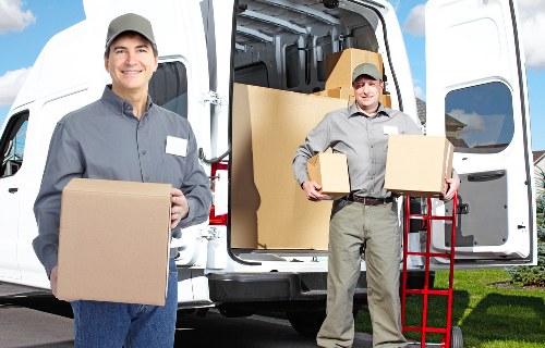 Trained moving staff handling boxes with care