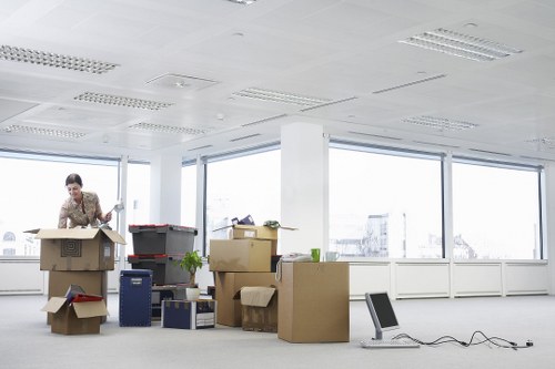 Packed boxes and furniture prepared for transport in Aldgate
